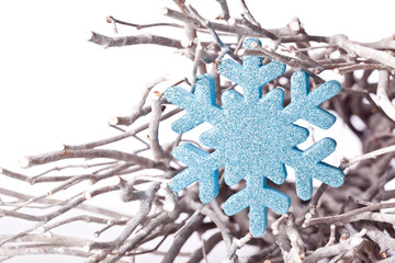 christmas snowflake star decoration on a branch