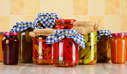 Composition with jars of pickled vegetables. Marinated food © monticellllo
