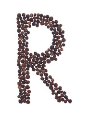 Letter R made of grains of pepper