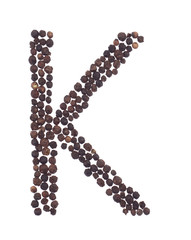 letter K made of grains of pepper