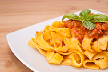 Pasta decorated with basil leaves