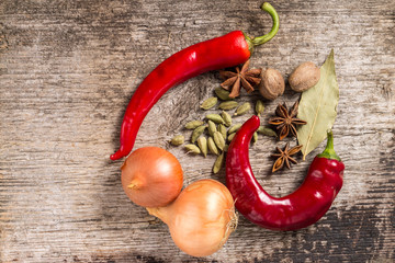 Rustic background of Spices on wooden plank