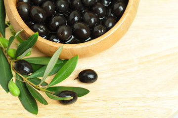 Olives with green leaves, background - food border