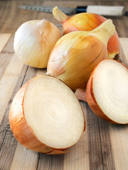Onions on the rustic board.