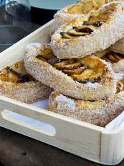 Apple pies in a wooden box.