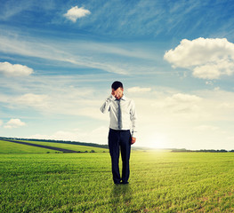unsuccessful man standing on the field