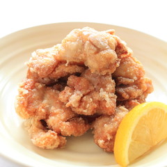 Close up Japanese Fried chicken with lemon on side