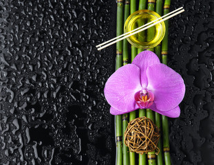 Macro of orchid and bamboo grove,massage oil,candle,