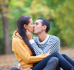 couple kissing outdoor in the park