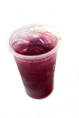 sweet fruit juice in plastic glass