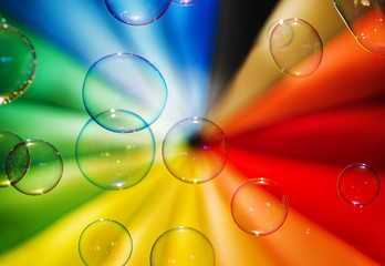 Soap bubbles and multi-coloured background