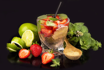 mojito strawberry cocktails, lime , strawberry, mint leaves on a