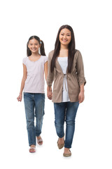 Mother and daughter. Full length of cheerful mother and daughter