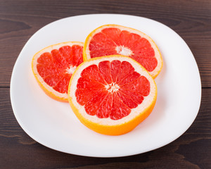 Fototapeta na wymiar Slice of grapefruit on a palte