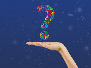 Question mark over palm of hand,background