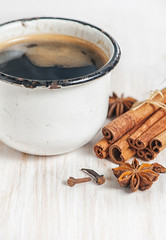 Old cup of coffee and spices