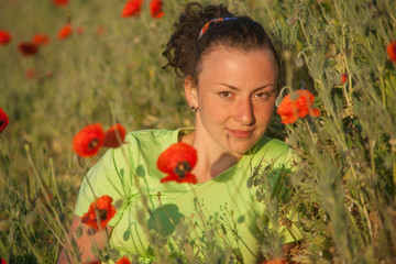 Naklejka premium Young beautiful woman on cereal field in summer
