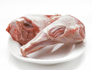 two integers raw beef shanks on white tray