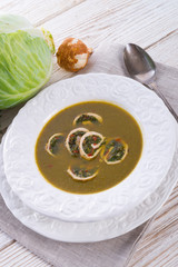 Cabbage soup with meat rolls