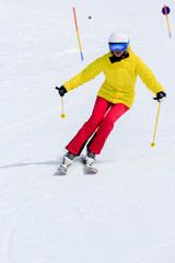 Skiing, skier, winter sports - woman skiing downhill