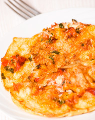 omelette with tomatoes, cheese and basil