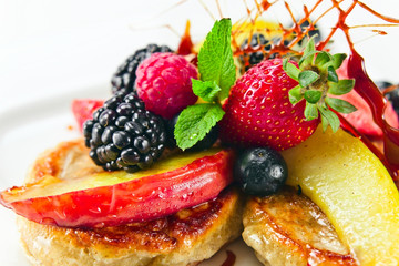 Dessert with baked apples and fresh berries