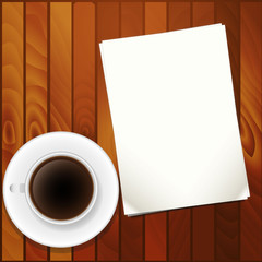 чашка кофе и листы бумаги на столе