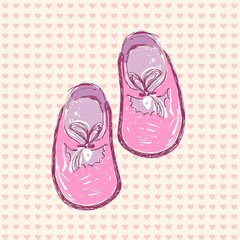 pink baby shoes in frame.