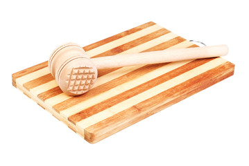 a wooden hammer for beating the meat