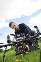 Engineer Fixing Camera On UAV Helicopter