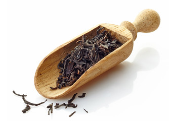 wooden scoop with black tea Assam