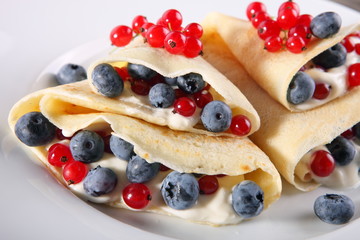 Pancakes with cream and fresh blueberries 