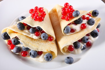 Pancakes with cream and fresh blueberries 