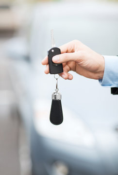 man with car key outside