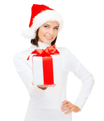 smiling woman in santa helper hat with gift box