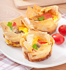 omelet in pita bread with tomato, bacon and mushrooms