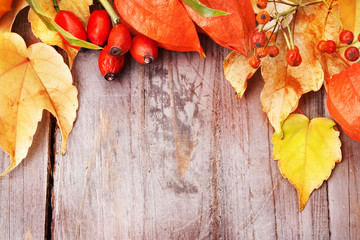 Autumnal border on wooden table, still life.