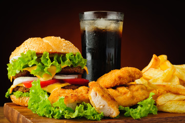 Burger, chicken nuggets, french fries and cola drink - 56254847