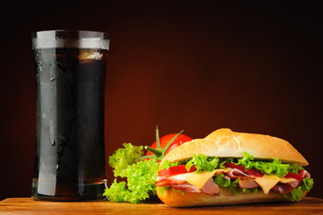 Sandwich, vegetables and cola - 56255285