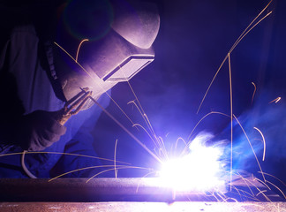 Welder on the industry workplace