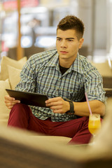Young man with tablet