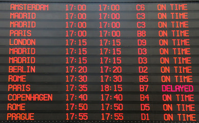 Flights departure information timetable in airport terminal