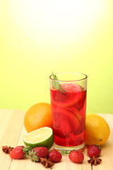 Refreshing sangria in glass with fruits,