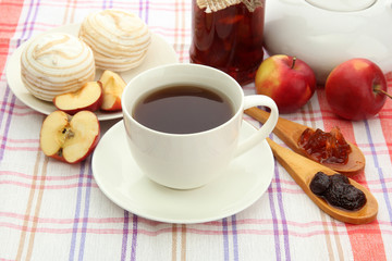 Fototapeta na wymiar light breakfast with tea and homemade jam, on tablecloth
