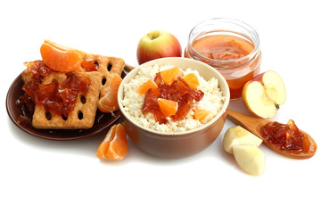 cottage cheese in bowl with homemade fruit jam, isolated