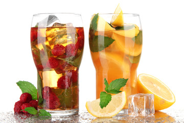 Iced tea with raspberries, lemon and mint isolated on white