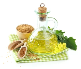 Fotobehang Jar of mustard oil and seeds with mustard flower © Africa Studio