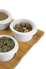 Assortment of spices in  white  bowls,