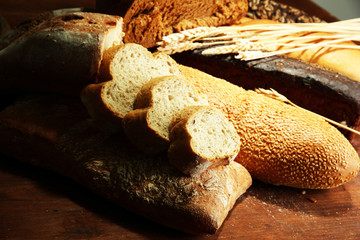 Much bread on wooden board