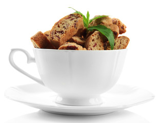 Tasty cookies in cup isolated on white